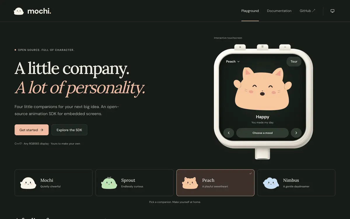The peach cat character smiling on the device screen in the dark theme